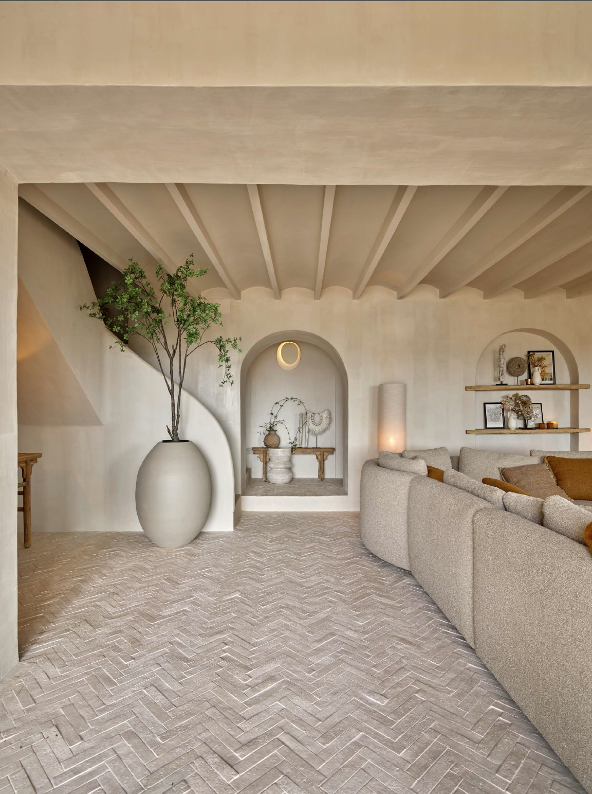 Bespoke Mediterranean interior with custom carpentry and lime plaster walls by The Loft Interiors